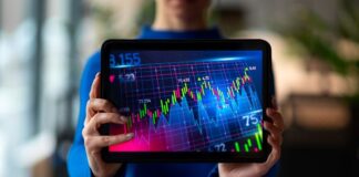 Where Fintech Meets Trading and Digital Transformation tablet with fintech meets trading graphs