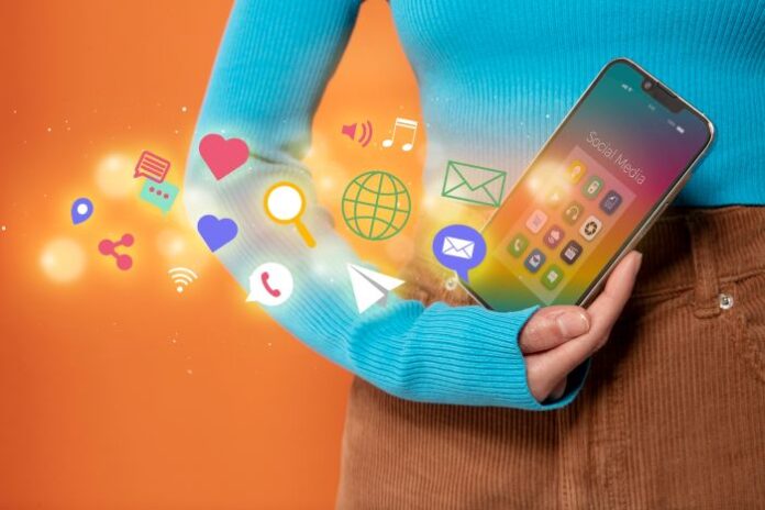 social media for online growth, shown with woman holding smartphone