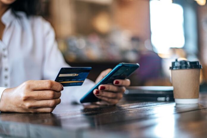 subscription servers have a payment gateway, as shown by woman on smartphone