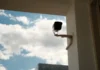 How Modern CCTV Technology Is Changing Home Security in Kent a security camera mounted to the side of a building