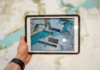 How Cloud-Based Dispatch Software Is Revolutionizing Fleet Operations a person holding tablet