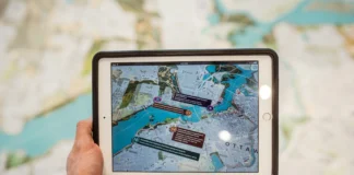 How Cloud-Based Dispatch Software Is Revolutionizing Fleet Operations a person holding tablet