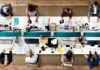 A Guide to Implementing Modern Workplace Solutions Smoothly modern workplace solutions aerial view of big desk
