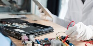 When to Upgrade vs Repair Your Computer Repair your computer, with technician and hard drive