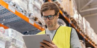 Furniture Delivery Software: Streamlining Logistics for Modern Industry person in hardware store using logistics software