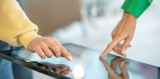 Top Features to Look for in Modern Touchscreen Applications A modern touchscreen with two users