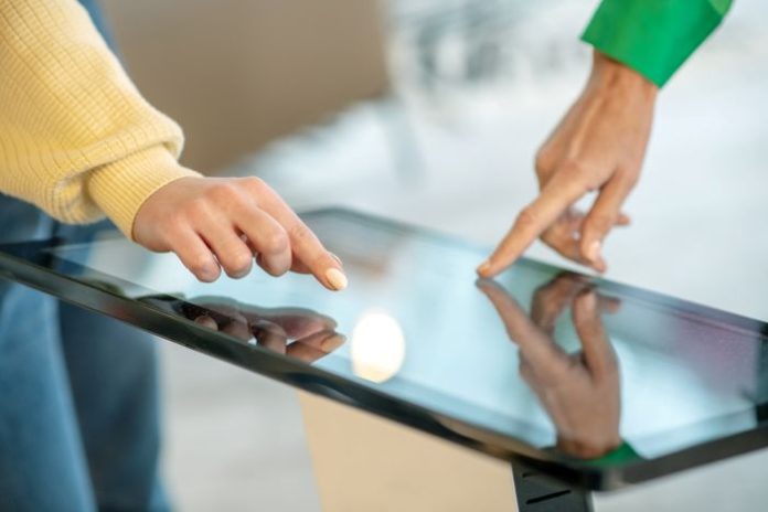 A modern touchscreen with two users