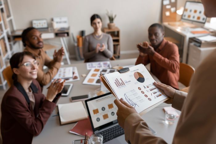 people in an office discussing strategic marketing