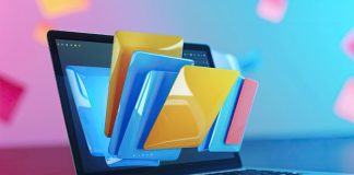 I Compared 5 PDF Conversion Tools – One Free Tool Crushed It laptop with files and folders coming out of the screen representing all the PDF conversion tools