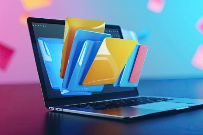 laptop with files and folders coming out of the screen representing all the PDF conversion tools