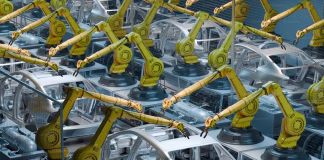 How AI-Powered Laser Platforms Are Transforming Smart Manufacturing in the EV Sector robots working on car frames