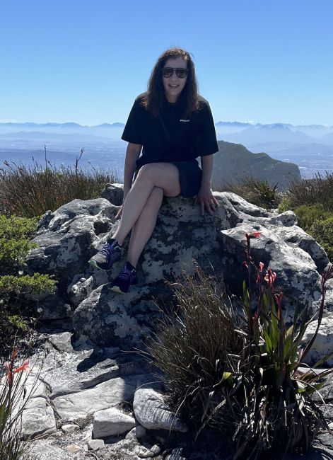 Ruby Kolesky sitting on top of a rock