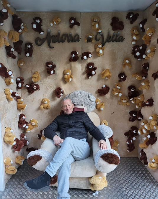 Charles Lambert surrounded by teddy bears