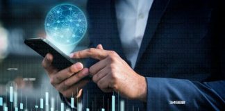 Top 5 Loan Management Software for Financial Institutions person on phone using fintech loan management