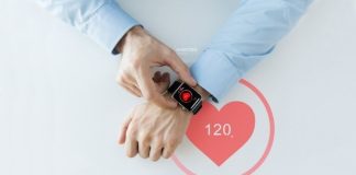 Helpful Tips for Designing Medical Devices top view of man checking his smart watch, important feature when designing Medical Devices