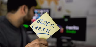 Top 5 Blockchain Technology Trends to Watch in 2026 person holding sticky note