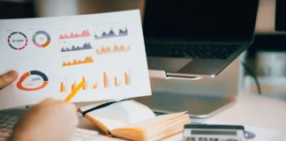 7 Questions to Ask Before Choosing a Business Data Vendor a person holding paper in hand