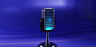 Wireless Microphone for Vlogging Is Essential for Software Content Creators microphone on stand on blue table