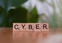 AI-Driven Transformation of Modern Cyber Defense Strategies scrabble block on table