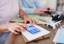 Itilite vs Concur vs Navan vs TravelPerk: The CIO’s Guide to Travel Management Software in 2026 a person using phone