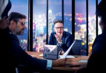 The Hidden Benefits of Adopting Enterprise Asset Management Solutions board team discussing asset management
