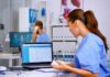 How ASC Software Platforms Help Streamline Daily Surgical Operations Doctor using laptop