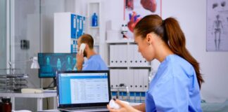 How ASC Software Platforms Help Streamline Daily Surgical Operations Doctor using laptop