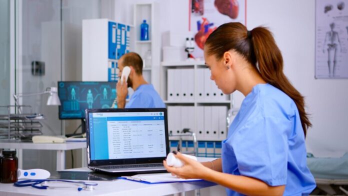 Doctor using laptop
