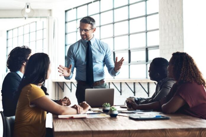 laptop-people-businessman-presentation-solution-problem-solving-teaching-meeting-leadership-workshop-mentor-talking-team-training-coaching-class-learning-opportunity team listening to their fractional cfos