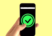 9 Working VPN Discount Codes for 2026: Best Deals and Savings A person holding black smartphone