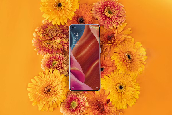 a cellphone surronded by flowers