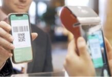 Cross-Border Acquiring: The Technology Behind Faster, Smarter, and More Secure Global Payment Processing a person scanning QR CODE