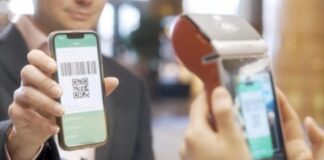 Cross-Border Acquiring: The Technology Behind Faster, Smarter, and More Secure Global Payment Processing a person scanning QR CODE