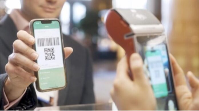a person scanning QR CODE