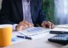 Top 5 High-Risk Payment Processors Ranked for Approval, Stability, and Multi-Rail Support person working on tablet