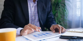Top 5 High-Risk Payment Processors Ranked for Approval, Stability, and Multi-Rail Support person working on tablet