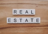 10 Leading Real Estate Software Companies in New York real estate blocks on table
