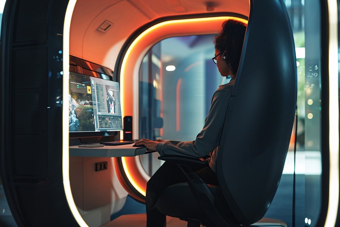 person in pod utilizing remote access