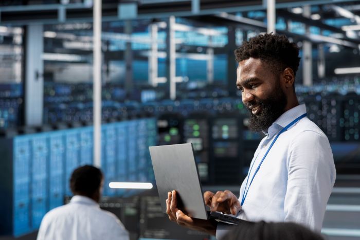 image of man looking at ram in server room