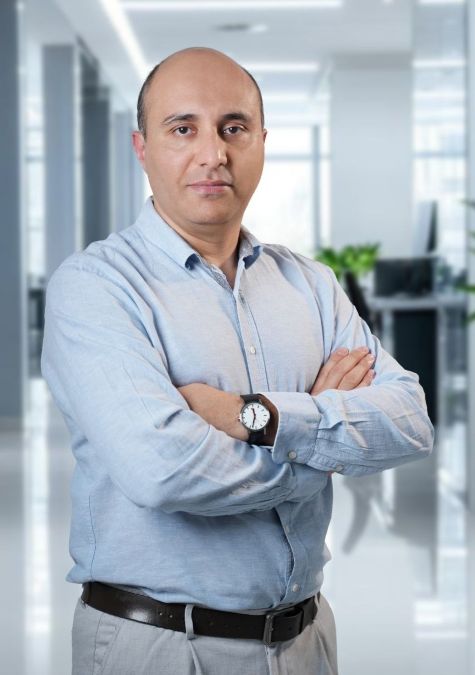 Mustafa Alamir with arms crossed