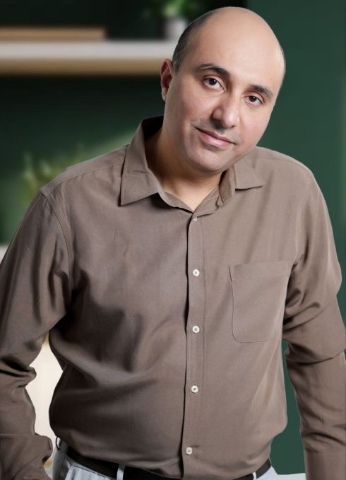 Mustafa Alamir smiling, head hilted